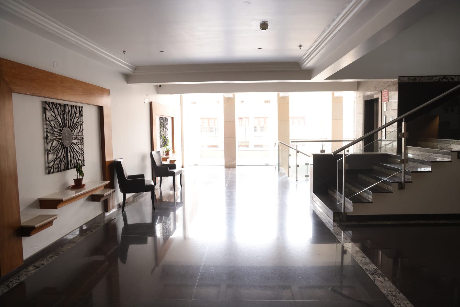 The ground-floor lobby, looking towards the entrance and the staircase